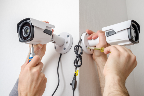 hands fixing security system service and installation